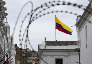 An Ecuadorian flag waves at the government palace in Quito