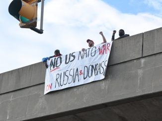 BaltimoreStoptheWarLiesCampaignbannerdroponoverpassMLKBlvd