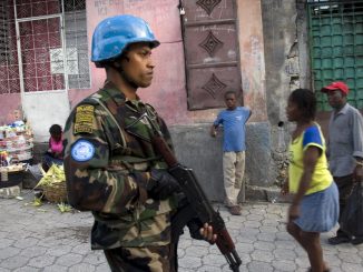 UN Peacekeepers Patrol Port au Prince Slum