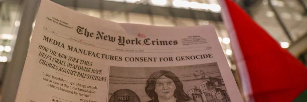 A new york times satire paper titled new york crimes is raised in a demonstration