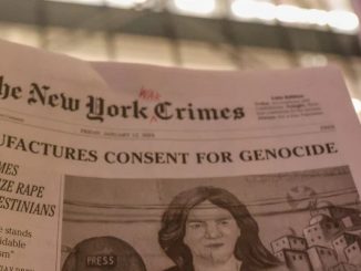 A new york times satire paper titled new york crimes is raised in a demonstration