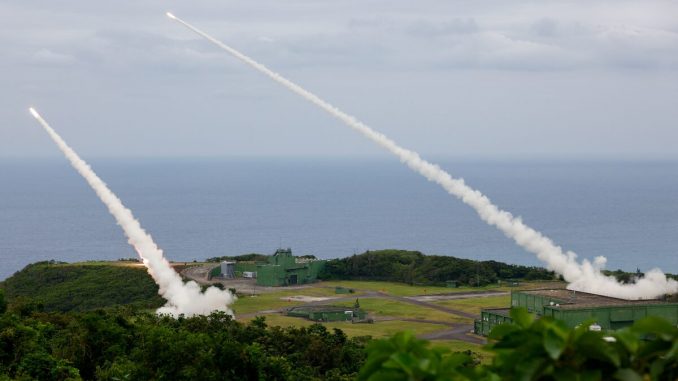 U.S.-supplied HIMARS rocket systems are test-fired by Taiwanese military forces at the Jiupeng base in Pingtung, Taiwan. The ongoing militarization of Chinese territory has accelerated with Washington's record $11.1 billion weapons package.