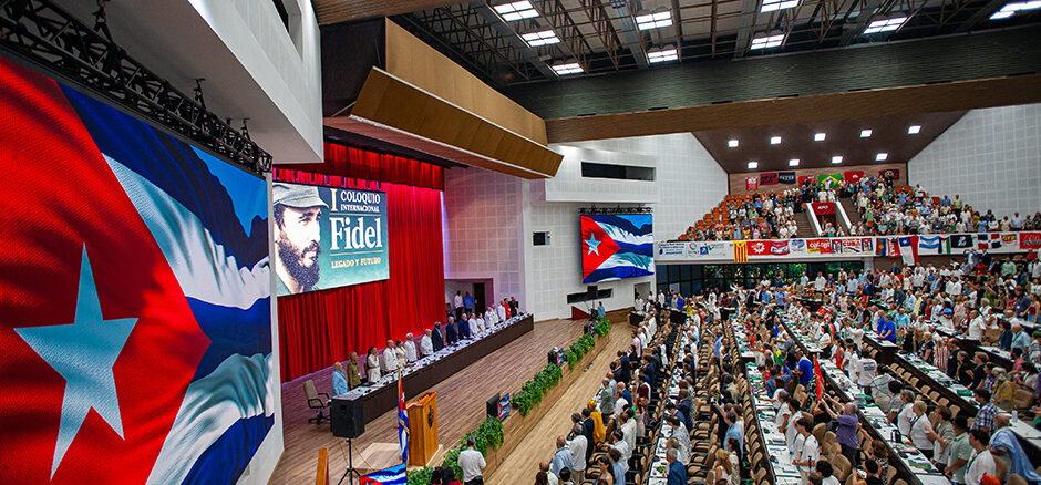 Photo shows packed auditorium in Havana for the International Colloquim in honor of Fidel’s 100th birthday