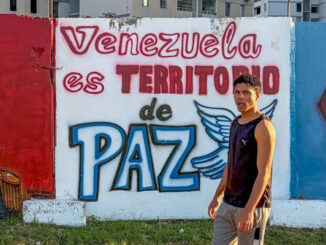 Mural reads venezuela is a peaceful territory in spanish
